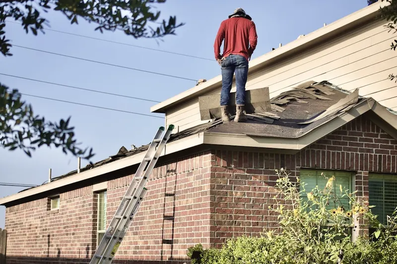 Professional roofer working on a residential roof in Miami Shores